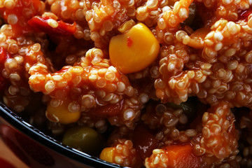 Delicious vegetarian quinoa salad with bell pepper, cucumber and tomatoes