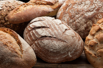Bread arranged on wooden table