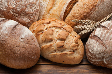 Bread arranged on wooden table