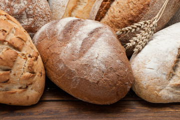 Bread arranged on wooden table