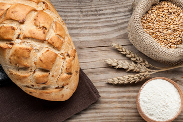 Fototapeta na wymiar loaf of bread on wooden table