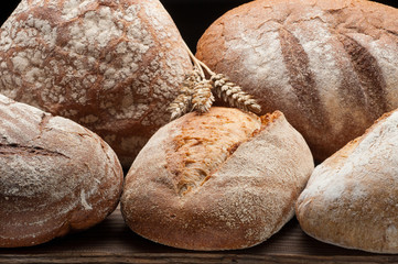 Bread arranged on wooden table