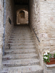 Old stone stairways in medieval city in Italy