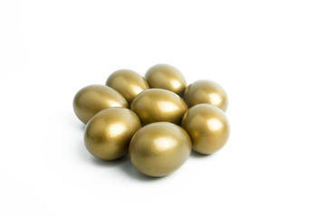 white isolated and gold eggs