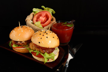 Delicious hot hamburger  on wooden background