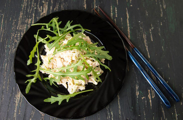 Chicken salad with rucola on a plate
