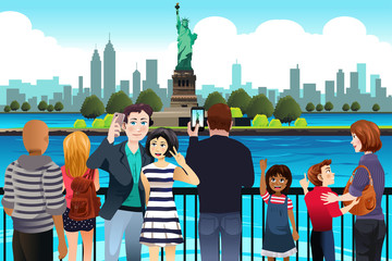 Tourists Taking Picture Near Statue of Liberty © artisticco