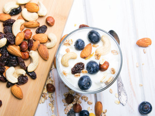 Healthy dessert with yogurt, nuts, oats and blueberries