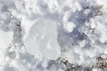 A piece of ice lay on the snow