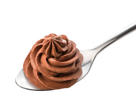 Chocolate frozen yogurt on the spoon isolated by clipping path. Whipped cream. Mascarpone. Macro.