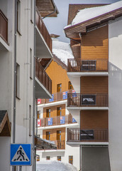Obraz premium Sochi Rosa Khutor Hotels in the snowy mountains, snowboarders and skiers, January 2017