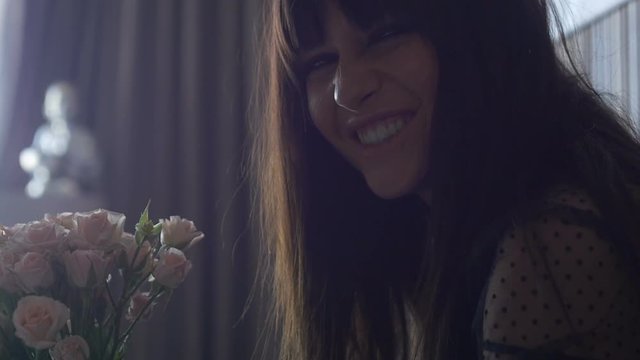 Portrait of female with bouquet of flowers