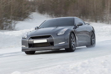 Sports car driving on icy road