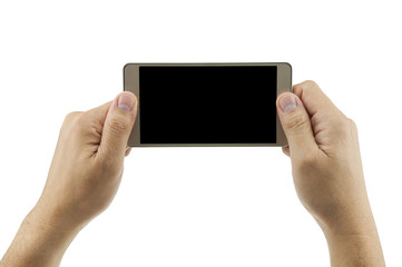 Isolated male hands holding mobile phone in blank black screen to take/watch photo. Mobile technology. Photo includes two clipping paths at outer edge and black screen.