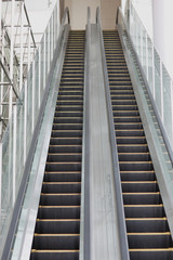 The escalator at the entrance to the building of the business center.