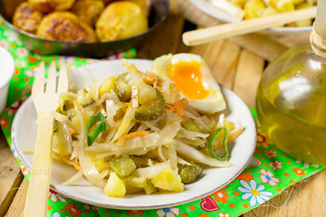 Potato salad with pickles and sauerkraut