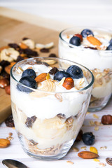 Healthy dessert with yogurt, nuts, oats and blueberries