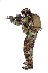 Portrait soldier or private military contractor holding sniper rifle.