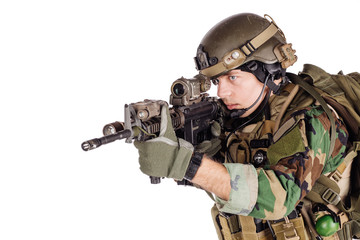 Portrait soldier or private military contractor holding sniper rifle.