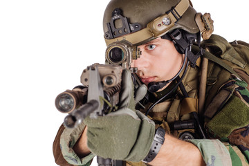 Portrait soldier or private military contractor holding sniper rifle.