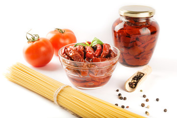 Italian spaghetti with ingredients for cooking pasta on a white background