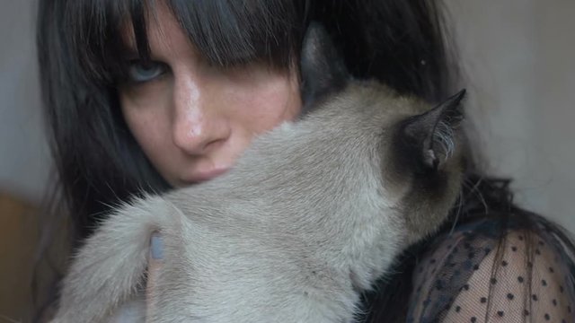 Brunette female with a cat