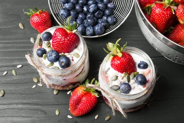 Foto op Plexiglas anti-reflex delicious dessert - yogurt with strawberries and blueberries © czarny_bez