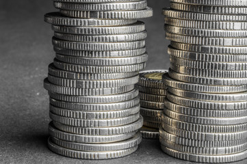 Stack of coins on dark background (Polish Five Zloty coins) - business concept