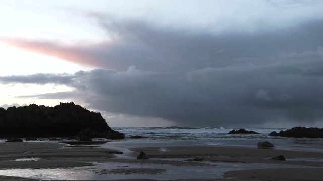 Time lapse of large thunderhead storm cloud off the Pacific Ocean building and coming in to the mainland of the Oregon Coast.