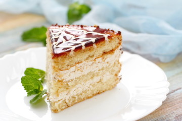 Delicious cake with cream and caramel