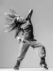 Young beautiful dancer posing in studio