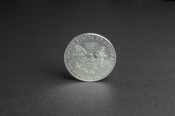 One US dollar coin silver - business concept, background