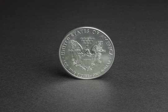 One US dollar coin silver - business concept, background