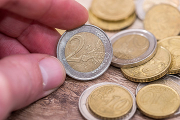 man showing euro coins. close up.  monetary.