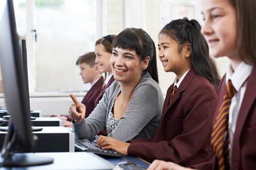 Pupils In Computer Class With Teacher