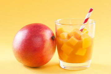 cubes of mango pulp isolated on a yellow background
