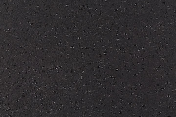 Water drops on dark stone