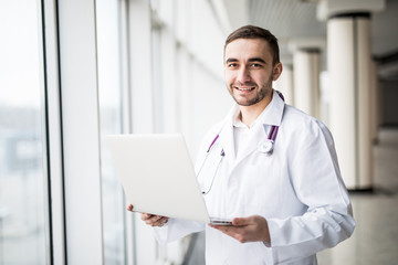 attractive young medical worker using laptop