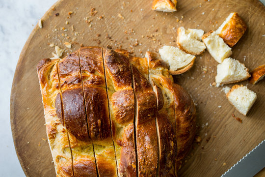 Sliced orange olive oil challah bread, overhead view