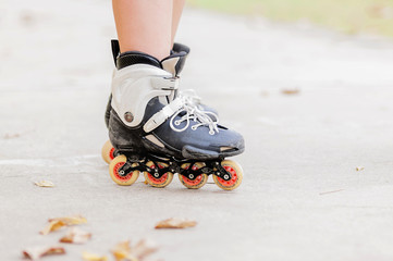 Closeup of boy is standing with roller blade, selective focused.