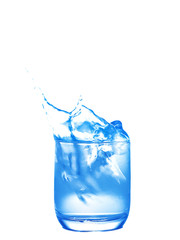 Soft focus of blue tone splash water in a glass