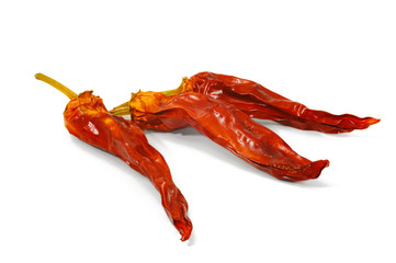Dried beans of red pepper on white background