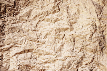 Brown tone crumpled paper abstract background
