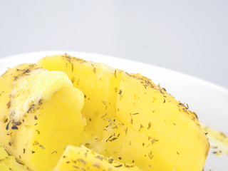 Baked potato with melt butter on top