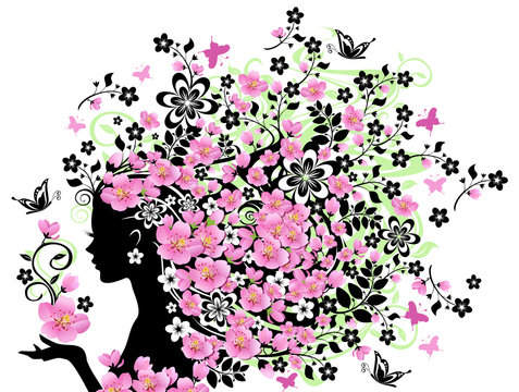 The concept of natural beauty. Beautiful woman with wonderful hair and cherry tree blossoms on her head.