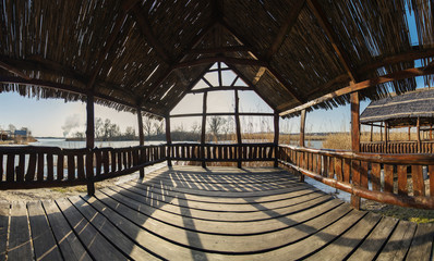 Wooden gazebo on the shore of the Gulf of winter