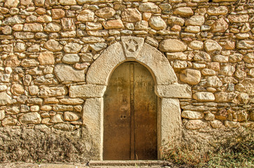 Fototapeta na wymiar Stone wall with door