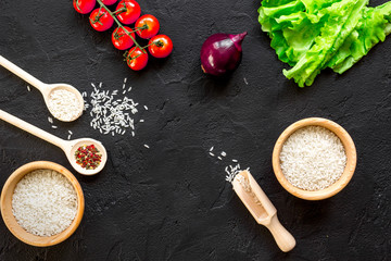 ingredients for paella on dark background top view