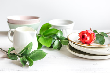 ceramic tableware with flowers on white background