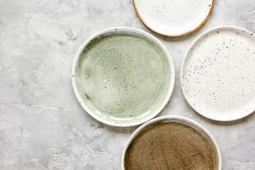 ceramic tableware top view on stone background mock up